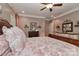 Comfortable main bedroom with stylish bedding, carpet, soft lighting, and elegant decor at 625 Saint Andrews Rd, Statesville, NC 28625