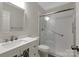 Bathroom featuring a sink vanity with white marbled counter, toilet, and shower with sliding doors at 6718 Heritage Orchard Way, Huntersville, NC 28078