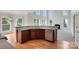 Kitchen view with granite counters, hardwood floors, stainless dishwasher and bright natural light at 6718 Heritage Orchard Way, Huntersville, NC 28078