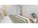 Bedroom featuring neutral decor, white bedding, hardwood floors, and ample natural light at 6749 Windyrush Rd, Charlotte, NC 28226