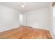 Bedroom featuring hardwood floors, neutral walls, ceiling fan, and closet at 6749 Windyrush Rd, Charlotte, NC 28226