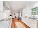 Bright kitchen features granite countertops, stainless steel appliances, and hardwood floors at 6749 Windyrush Rd, Charlotte, NC 28226