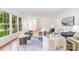 Sunlit living room with hardwood floors, stylish furniture, and large windows at 6749 Windyrush Rd, Charlotte, NC 28226
