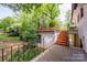 Backyard features a patio, upper deck, and stairs leading to a lower level at 7123 Linda Lake Dr, Charlotte, NC 28215