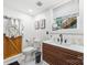 Bright bathroom features a modern vanity, hexagon tile floor, and rustic barn-style door at 7123 Linda Lake Dr, Charlotte, NC 28215