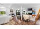 Spacious living area with a modern design including a work space, lounging area, and fireplace feature at 7123 Linda Lake Dr, Charlotte, NC 28215