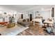 Open-concept living area features a kitchen, seating, and bedroom space, creating a flexible design at 7123 Linda Lake Dr, Charlotte, NC 28215