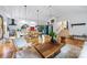 Spacious living area featuring hardwood flooring, modern lighting, and an open layout at 7123 Linda Lake Dr, Charlotte, NC 28215
