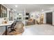 Open-concept living space with brick fireplace, desk area, and modern decor at 7123 Linda Lake Dr, Charlotte, NC 28215