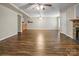 Finished basement area with hardwood flooring, a stone fireplace, and a ceiling fan at 814 Settlers Dr, Cherryville, NC 28021