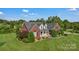 Well-kept brick home features lush landscaping and inviting curb appeal at 814 Settlers Dr, Cherryville, NC 28021