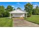 Detached garage with white siding and a long driveway at 814 Settlers Dr, Cherryville, NC 28021