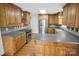 Spacious eat-in kitchen features wood cabinets, stainless steel appliances, and hardwood floors at 814 Settlers Dr, Cherryville, NC 28021