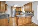 Spacious eat-in kitchen features wood cabinets, stainless steel appliances, and hardwood floors at 814 Settlers Dr, Cherryville, NC 28021