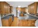 Spacious eat-in kitchen features wood cabinets, stainless steel appliances, and hardwood floors at 814 Settlers Dr, Cherryville, NC 28021