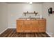 Charming kitchenette with wooden cabinets, sink, shelf, and ample counter space, perfect for convenient meal preparation at 814 Settlers Dr, Cherryville, NC 28021