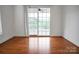 Bright living room with wood floors and sliding doors to the back deck and backyard at 814 Settlers Dr, Cherryville, NC 28021