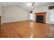 Bright living room featuring wood floors and a cozy fireplace at 814 Settlers Dr, Cherryville, NC 28021