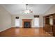 A well-lit living room with hardwood floors, a fireplace, and neutral tones at 814 Settlers Dr, Cherryville, NC 28021