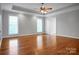 Bright and airy main bedroom features hardwood floors, large windows, and a ceiling fan at 814 Settlers Dr, Cherryville, NC 28021
