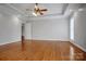 Spacious main bedroom features tray ceiling, wood floors, large windows, and a ceiling fan at 814 Settlers Dr, Cherryville, NC 28021