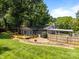 Overhead view showcasing a private lot with mature trees and a fenced backyard with an outdoor patio at 917 Dent Ct, Charlotte, NC 28210