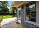 Backyard view showcasing an attached patio deck, door, and exterior wall at 917 Dent Ct, Charlotte, NC 28210