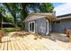 Exterior shot of home showcasing a beautiful wooden deck, door, and backyard at 917 Dent Ct, Charlotte, NC 28210