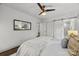 Comfortable bedroom featuring sliding barn door to bathroom, soft lighting, and a calming atmosphere at 917 Dent Ct, Charlotte, NC 28210