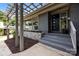 Close-up of modern front door and a stone accent wall for added curb appeal at 917 Dent Ct, Charlotte, NC 28210