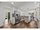 Expansive kitchen with stainless steel appliances, island cooktop, and an open layout to the dining area at 917 Dent Ct, Charlotte, NC 28210