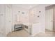 Bathroom featuring soaking tub, neutral paint, and decorative accents at 9710 Holden Ct, Charlotte, NC 28277