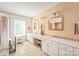 Bathroom features double sink vanity, large mirrors, and tiled accents at 9710 Holden Ct, Charlotte, NC 28277