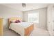 Bedroom featuring neutral carpet, and large window providing natural light at 9710 Holden Ct, Charlotte, NC 28277