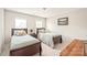 This bedroom features two beds, two windows and natural light at 9710 Holden Ct, Charlotte, NC 28277