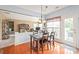 Open dining area with adjacent living space, with lots of light, provides a great space to relax at 9710 Holden Ct, Charlotte, NC 28277