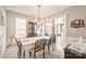 Formal dining room with elegant chandelier and large windows at 9710 Holden Ct, Charlotte, NC 28277