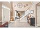 Spacious foyer with tile floors and a staircase leading to the second floor at 9710 Holden Ct, Charlotte, NC 28277
