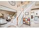 Elegant two-story foyer featuring a staircase and views into the living room at 9710 Holden Ct, Charlotte, NC 28277