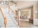 Bright foyer featuring a staircase and view into the formal dining area at 9710 Holden Ct, Charlotte, NC 28277