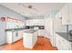 Spacious kitchen features white cabinetry, center island, modern appliances and ample room for cooking at 9710 Holden Ct, Charlotte, NC 28277