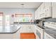 Efficient kitchen with stainless appliances, center island, and ample countertop space for easy meal preparation at 9710 Holden Ct, Charlotte, NC 28277