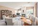Bright living room features a cozy fireplace, vaulted ceilings, and a well-stocked bookcase at 9710 Holden Ct, Charlotte, NC 28277