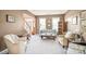Bright living room with soft carpet and comfortable seating arrangement at 9710 Holden Ct, Charlotte, NC 28277