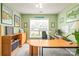 The office has built-in storage, a large window, and ample space for working from home at 9710 Holden Ct, Charlotte, NC 28277