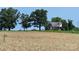Quaint brick home nestled in a serene, picturesque landscape with a well-kept golden wheat field at Tbd Jerusalem Church Rd, Marshville, NC 28103