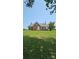 Charming brick home with a covered porch, surrounded by a well-maintained lawn and mature trees at Tbd Jerusalem Church Rd, Marshville, NC 28103