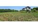 Pasture view featuring a farm surrounded by vibrant green crops growing abundantly under a clear sky at Tbd Jerusalem Church Rd, Marshville, NC 28103