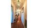 Long hallway with hardwood floors and decorative lighting, leading to various rooms in the home at Tbd Jerusalem Church Rd, Marshville, NC 28103
