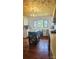 Bright kitchen featuring white cabinets, wood floors, and a rolling kitchen island for added convenience at Tbd Jerusalem Church Rd, Marshville, NC 28103